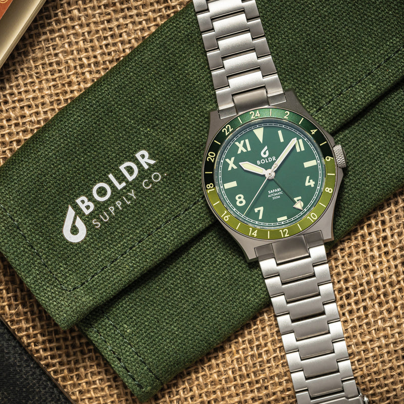 BOLDR Safari watch with a green dial, Roman and Arabic numerals, and a stainless steel bracelet.