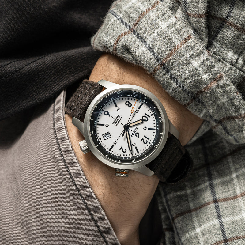 BOLDR Expedition White Sands watch with a white dial and compass bezel, showcasing its rugged design and functionality.