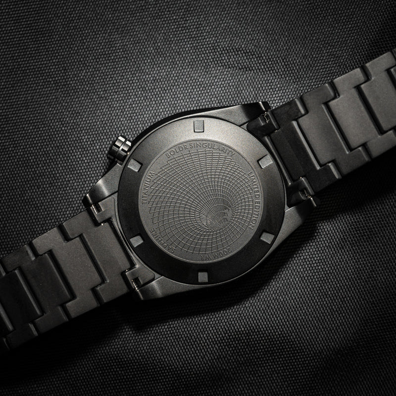 Close up on Venture Singularity watch with black caseback and backdrop