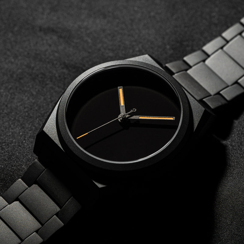 Close up on Venture Singularity watch with black dial bracelet and backdrop